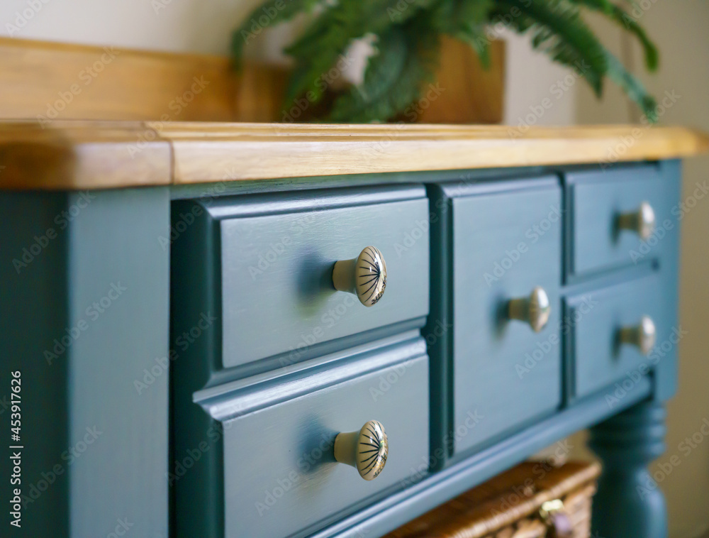 a beautiful hand painted deep blue dresser with finished wooden joinery top  Stock Photo | Adobe Stock