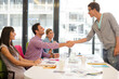 © KOTO - Business people shaking hands in meeting