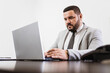 © Nexa - Businessman working in office with laptop and documents on his desk, consultant lawyer concept.