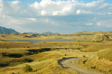  A road among the sandy mountains. The road to Cape Meganom. Crimea.
