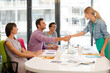 © KOTO - Business people shaking hands in meeting