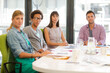 © KOTO - Portrait of business people smiling in meeting