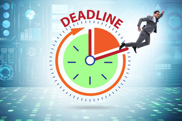 Businessman in deadline and time management concept