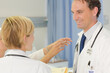 © KOTO - Doctor checking syringe in hospital room