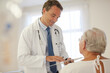 © KOTO - Doctor talking to older patient in hospital
