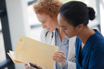 Wall Mural - Doctor and nurse talking in hospital hallway