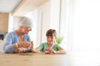 © KOTO - Older woman and granddaughter counting pennies