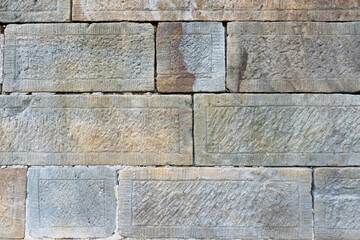 Close up view of old sandstone wall.