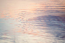 Sunset Colors Reflected In Lake Ripples
