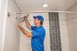 Plumber installing showerhead