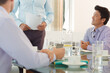 © KOTO - Business people sitting in meeting