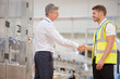 © KOTO - Supervisor and worker shaking hands in factory