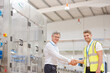 © KOTO - Supervisor and worker shaking hands in factory