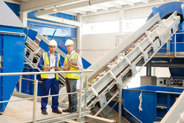 workers talking in recycling center