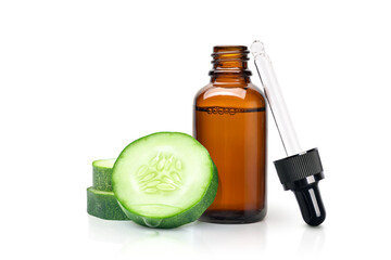 Wall Mural - Cucumber essential extract  oil serum with cucumber slices isolated on white background.