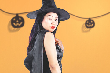 Wall Mural - Asian witch woman with a hat standing