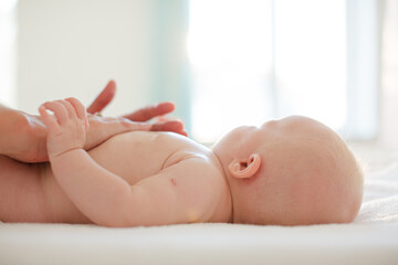 mother touching baby girl