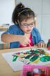 © Bangkok Click Studio - Asian girl with Down syndrome painting