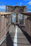 Fototapeta Nowy Jork - Brooklyn Bridge in New York, USA. People walk along the famous Brooklyn Bridge.