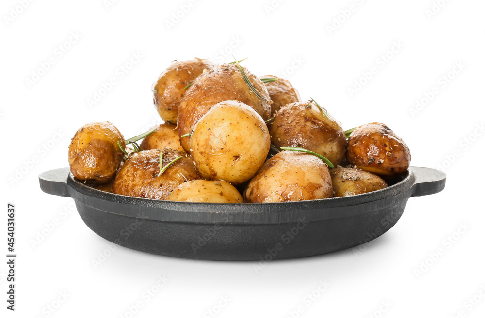 Frying pan with baked potatoes and rosemary on white background