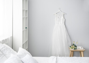 Poster - Interior of bedroom with beautiful wedding dress prepared for ceremony