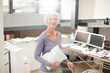 Businesswoman carrying paperwork in office