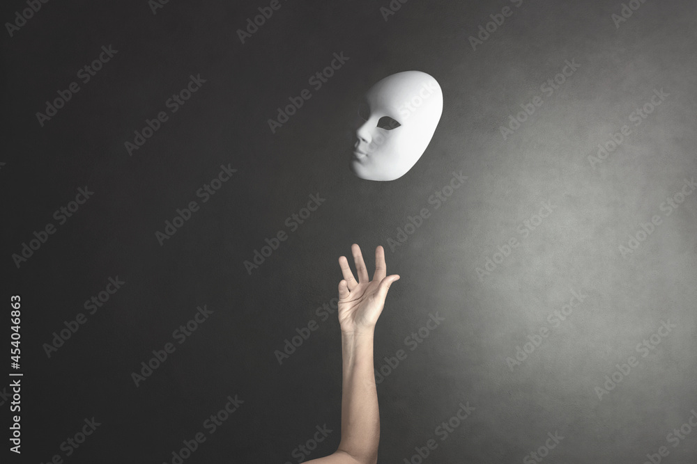 person throws the mask he wore into the air to get rid of it - obrazy, fototapety, plakaty 