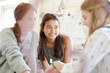 © KOTO - Three teenage girls relaxing in bedroom