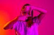 © Lustre Art Group  - Portrait of young beautiful caucasian girl isolated on pink neon background