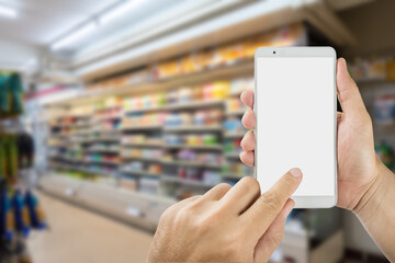 hand of a person is using a mobile phone in a mall,display area is empty.