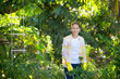 © Jeanette Goh - Asian woman in the outdoor farming.Pretty lady in the garden growing vegetables and plants. Owner and agriculture.Beautiful female farmer harvesting in farmland.Organic vegetation.Local produce.