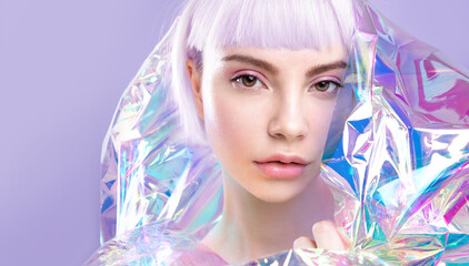 cool fashion young blond girl with lavender hair and perfect makeup, healthy glowing skin in colorfu