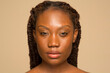 © Phiwo Ndlovu/Cultura Creative - Studio portrait of woman with braided hair