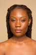 © Phiwo Ndlovu/Cultura Creative - Studio portrait of woman with braided hair