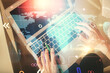 © peshkova - Double exposure of woman hands working on computer and world map hologram drawing. Top View. International business concept.