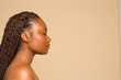 © Phiwo Ndlovu/Cultura Creative - Profile of shirtless woman with braided hair and eyes closed