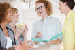 © KOTO - Women with coffe cup talking in office
