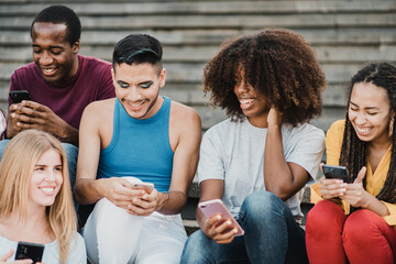 Wall Mural - Young people having fun together with smartphone outdoor in the city - Focus on gay man face