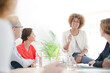 © KOTO - Office workers talking at desk