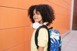 © PintoArt - handsome boy with headphones and backpack, back to school