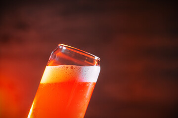 Wall Mural - A glass of beer on a wooden background