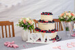 wedding cake decorated with raspberries