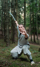 Kung Fu Warrior Practicing With Sword