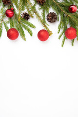 Wall Mural - Christmas white background with a fir branch, cones and fir balls, flat lay, top view