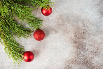 Wall Mural - Christmas background with Christmas tree toy and Christmas tree branches, top view