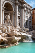 famous trevi fountain in rome with flowing water