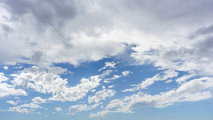 Wall Mural - white clouds and blue sky suitable for background or subsitution