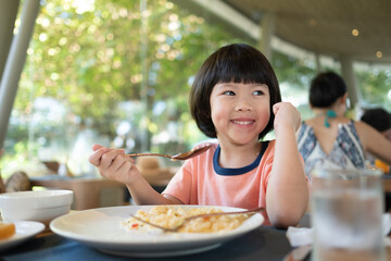 Wall Mural - Little girl have breakfast, happy time
