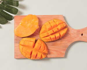 Wall Mural - Fresh mangoes are suitable as a snack menu in the morning or snacks during your spare time. Mango is rich in vitamin A which is good for the body which has the potential to prevent diabetes. 