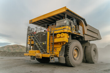 Wall Mural - A close-up of a dump truck. The action takes place in an open pit.